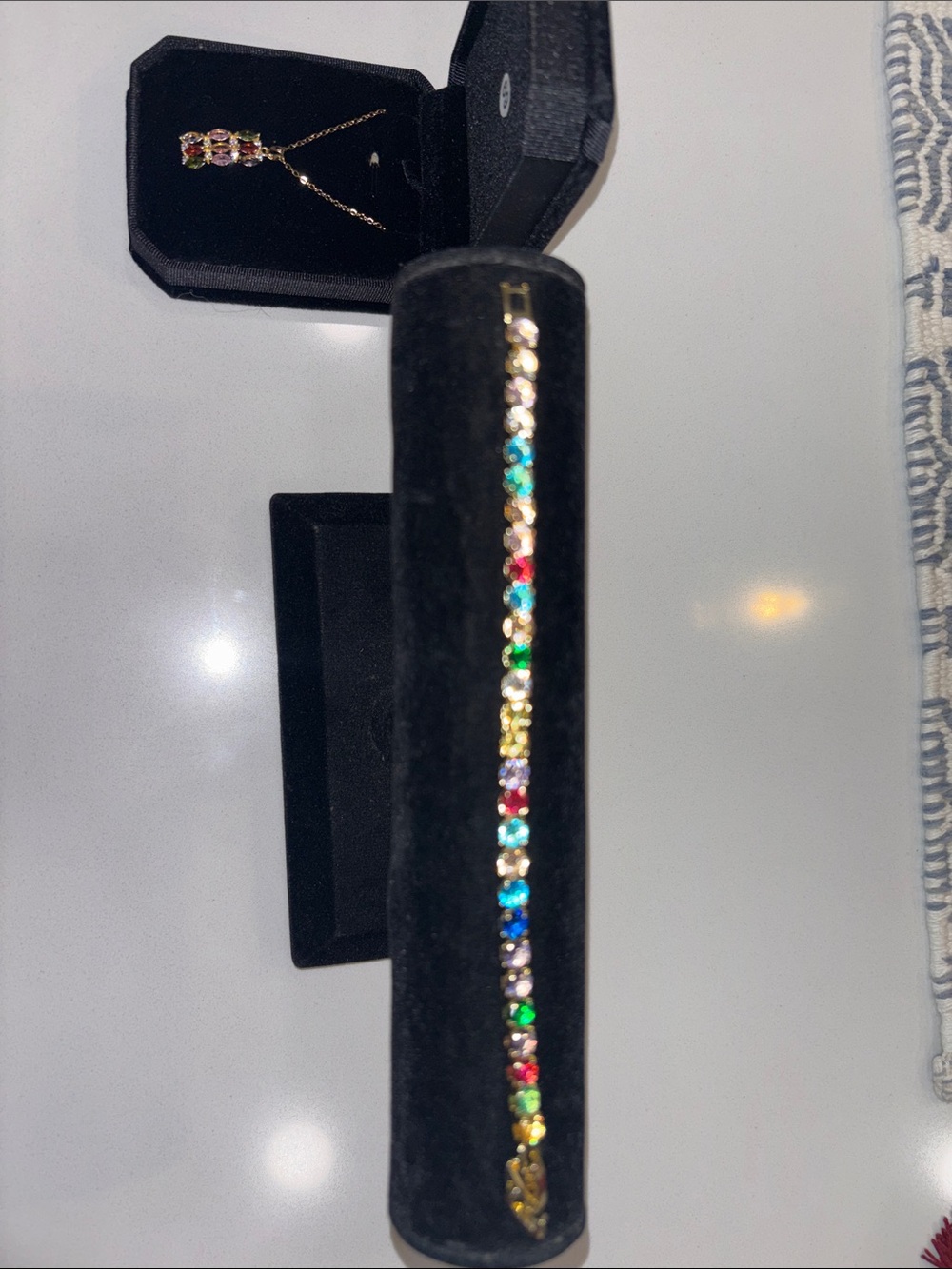 Gold tone, multicolored gem necklace, and tennis bracelet